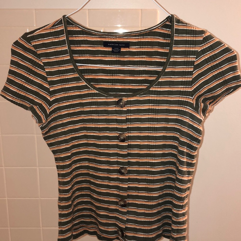 green and orange striped t-shirt